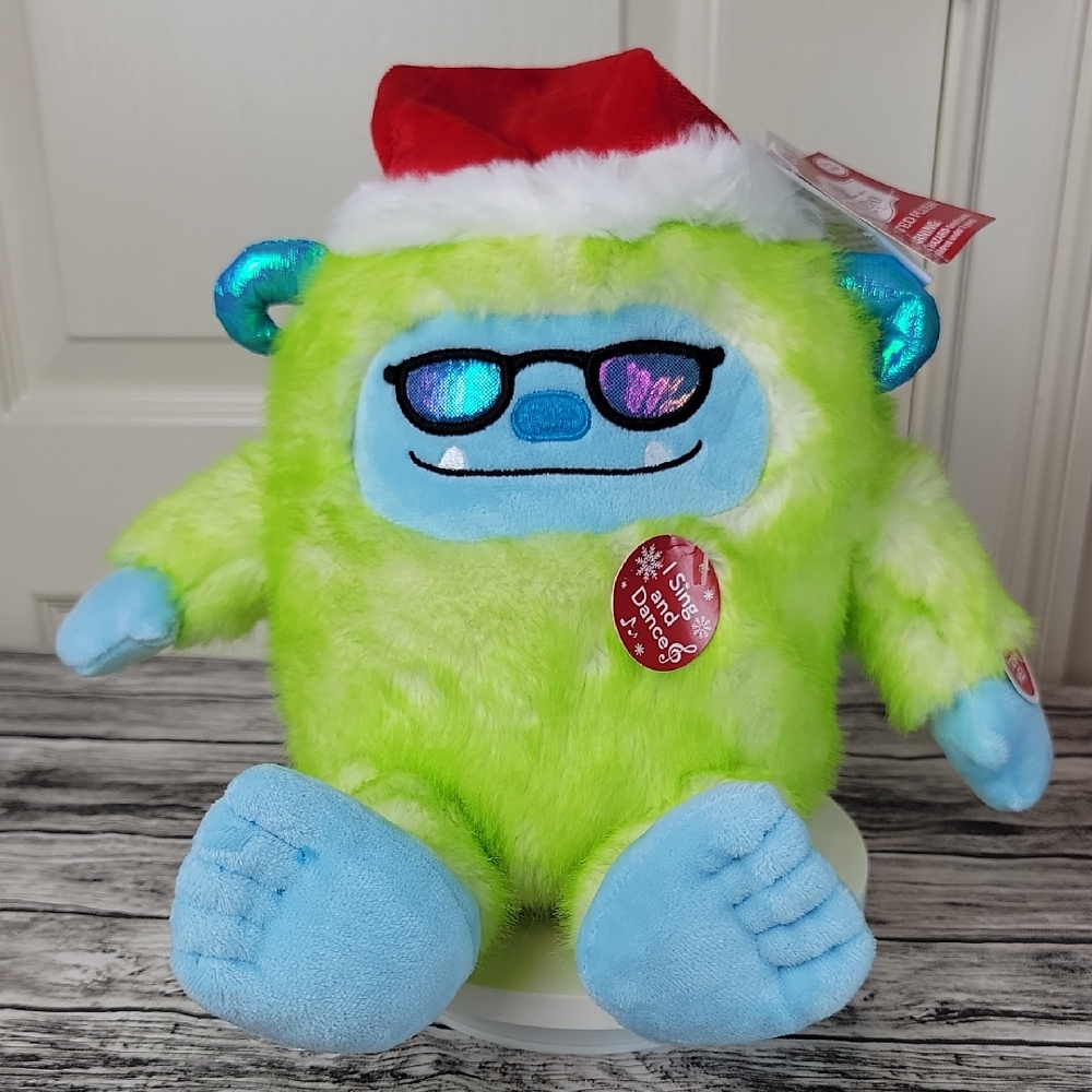 Festive Green and Blue YETTI Plush Toy with Santa Hat / sunglasses